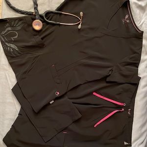 Smitten women’s scrubs. Super cute and stylish! Black and pink, size XS.